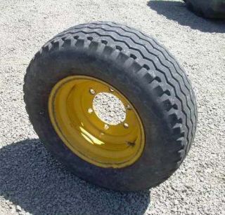 11Lx16 Firestone Backhoe Tire on 6 lug wheel