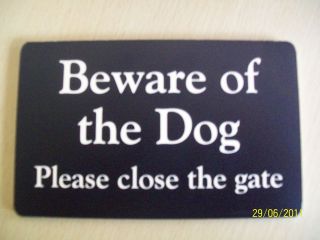 Garden gate sign Beware of the dog.
