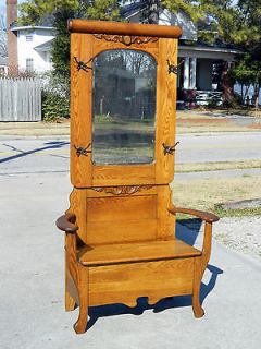   Golden oak Hall Tree with Coat Hooks and Lift Seat circa 1900