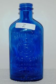 old blue glass milk of magnesia bottles