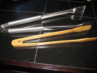 Lot of 2 long tongs   one Weber stainless steel, one bamboo