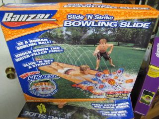   in package Banzai Slide N Strike Bowling Slide water filled pins pool