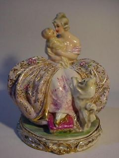 divine guido cacciapuoti lady figurine with baby dog from uruguay