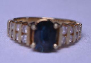 14K YELLOW GOLD OVAL SAPPHIRE AND DIAMOND RING   1.5 CARATS TW   SIZE 