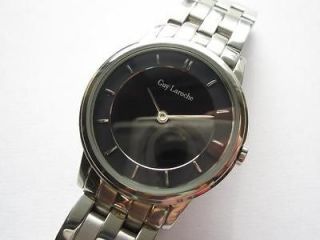 Guy Laroche round N.O.S stainless steel ladies watch runs and keeps 