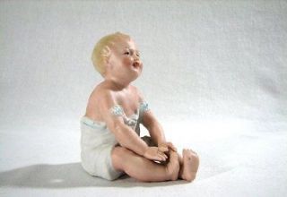 antique piano baby figurine made by gebruder heubach time left