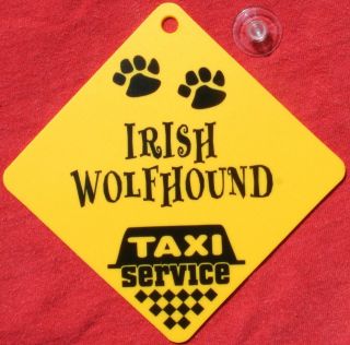irish wolfhound dog taxi service car window yellow sign time