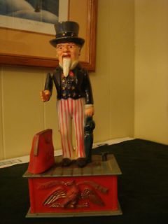 Actual Vintage Uncle Sam mechanical bank . plastic and working