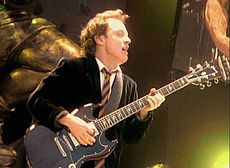 Angus Young performs in Cologne , Germany in 2001 during the Stiff 