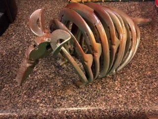 ARMADILLO made from scrap metal and horseshoes.