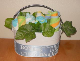 this adorable baby boy flower basket contains 3 burpcloths and