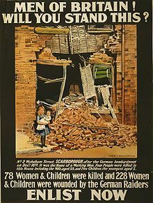Picture of girl holding infant in front of bombed out building 
