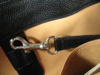 below leather covered accessory mirror on right side of photo