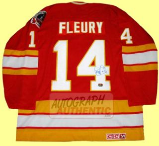 Calgary Flames jersey autographed by Theo Fleury. The jersey is semi 