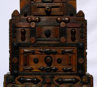 An exceptional and unusual, folky decorated seven drawer cupboard