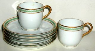 These are two beautiful demitasse and saucer sets plus three 