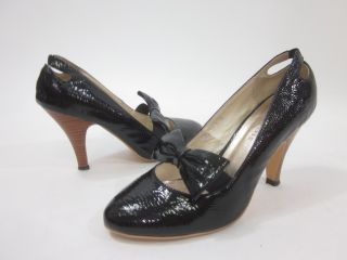 you are bidding on a pair of colin davis black patent leather bow