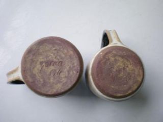 Pair of hand thrown mugs signed Doran 76. 2 3/4 diameter at mouth