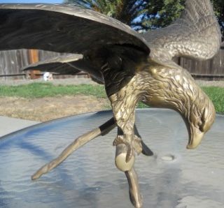 auction is a very large solid brass eagle statue. This fabulous eagle