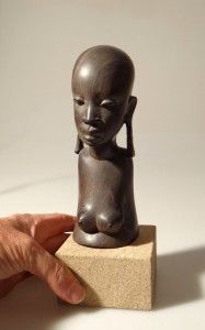 african ebony carved portrait topless tribal girl