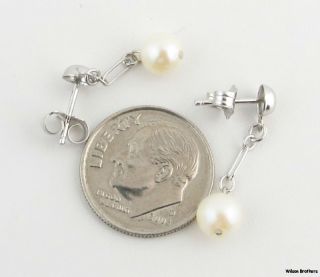 Each earring measures 29/32 (23mm) in length . The pair weighs a