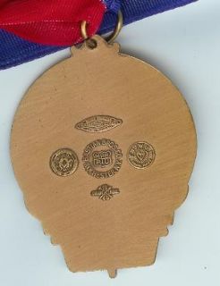 this auction is for a very fine george meany award the medal is