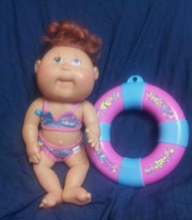 Cabbage Patch doll hard body can be put in water green eyes and