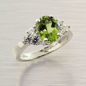 Natural Peridot 9x7mm Oval Sterling Silver Accented Ring Size 6 3/4