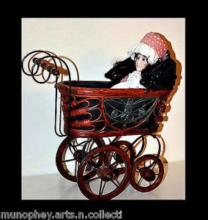 VINTAGE WOOD AND METAL DOLL CARRIAGE WITH A PORCELAIN DOLL SALE