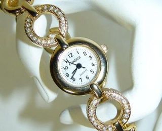 LADIES BEAUTIFUL FONDINI WRIST WATCH GOLD TONE WITH CRYSTALS ON BAND