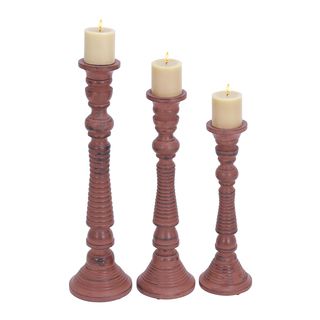 Pink Wood Candle Holders (set Of 3) (PinkMaterial WoodQuantity Three (3) candle holdersSetting Indoor Small candle holder dimensions 17 inches high x 6 inches wide x 6 inches deepMedium candle holder dimensions 21 inches high x 6 inches wide x 6 inch