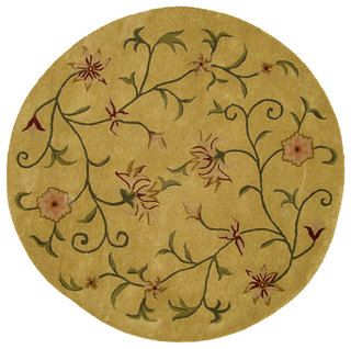 Hand tufted Autumn Wool Rug (6 Round) (GoldPattern FloralMeasures 0.625 inch thickTip We recommend the use of a non skid pad to keep the rug in place on smooth surfaces.All rug sizes are approximate. Due to the difference of monitor colors, some rug col