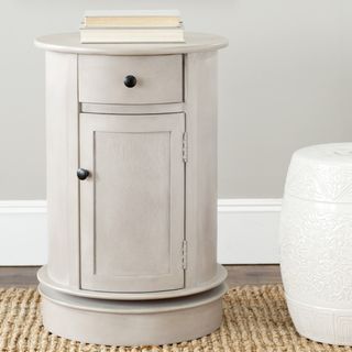 Safavieh Cape Cod Grey Swivel Storage Cabinet (GreyMaterials Pine woodFinish GreyDimensions 26 inches high x 17.7 inches wide x 17.7 inches deepAvoid placing your furniture in direct sunlight and maintain at least two feet between furniture and heat so